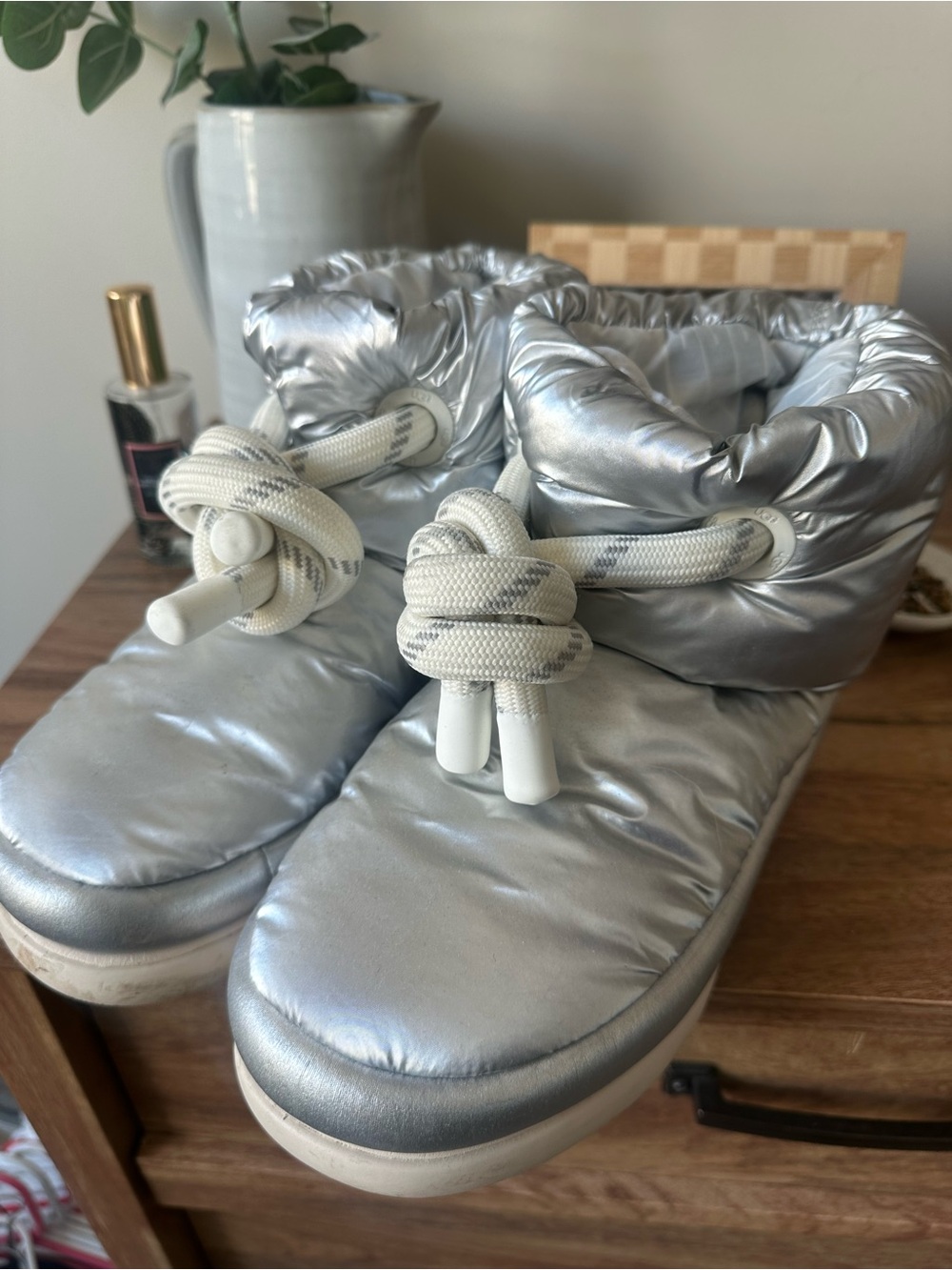 Silver Puffer Ugg boots with knotted detail